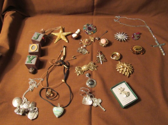 Assorted brooches, hat pins, and more