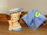 Lady and blue fluted vase