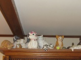 Shelf of cats