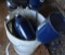 PAIL OF EAGLE BRAND OIL PUMP CANS
