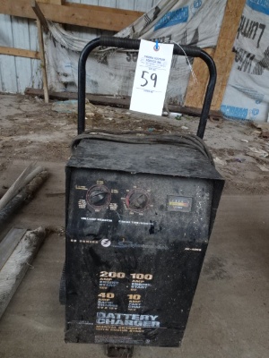 59. schumacher 200 amp battery charger, plugged in ok