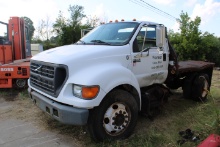 2000 Ford F-650 S/A stake truck, wreck dmg.