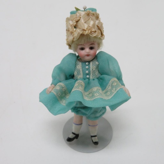 Porcelain miniature dollhouse doll