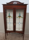 Ornate leaded glass two door cabinet