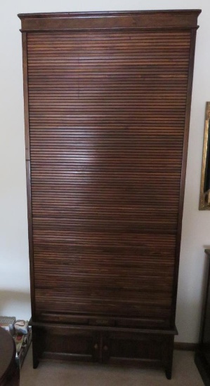 Unusual tall roll front cabinet