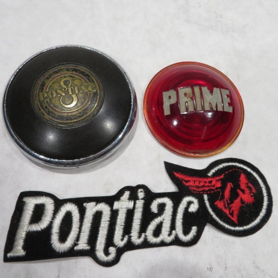 Pontiac Deco style steering wheel emblem and Prime tail light lens