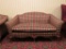 Plaid Loveseat with shell and paw feet
