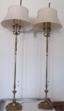 Two brass floor lamps