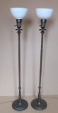 Two metal floor lamps