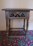 Feudal Oak Drop front lamp table with carved peacocks