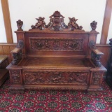 Fabulous highly ornate carved entry bench with cherubs and gargoyles