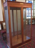 Oak mirrored back glass display cabinet