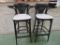 Two wooden counter stools, padded seat