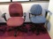 Two Rolling fabric office chairs