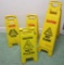 Four floor standing CAUTION Wet Floor signs