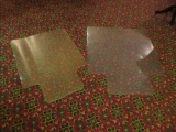 Two plastic rolling desk chair mats