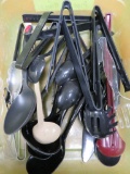 Assorted serving spoons, ladles and tongs