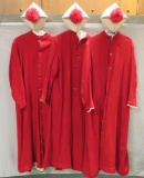 Three red robes and Biretta hats