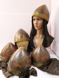 Five leather helmets with metal trim and metallic neck guards