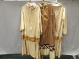 Three robes with ornate trim and one tassel belt