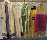 Ornate and embellished Robes and Tunics with age and material wear noted