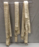 11 White belts with metal buckles, some age discoloration noted
