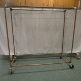 Tubular metal two sided rolling garment rack