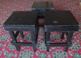 Three wooden stools, painted black
