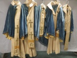 Four complete Robe, Cloak and Vestment sets with extra cloak