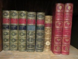 Eight ornate leather bound books