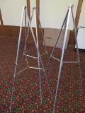 Three metal floor easels, folding