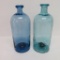 Two smooth pontil lovely colored early bottles, 9