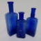 Three Cobalt medicine bottles