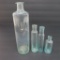 Four open pontil bottles, 2 1/2