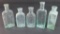 Five assorted medicine bottles, 3