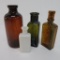 Four multi color lot of early bottles, 3