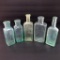 Five small medicine bottles, 5