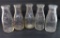 Five Waukesha embossed milk bottles, quart