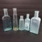 Five old medicine bottles