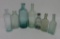 Seven early glass bottles