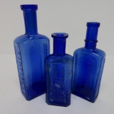 Three Cobalt medicine bottles