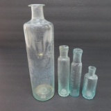 Four open pontil bottles, 2 1/2