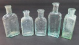 Five assorted medicine bottles, 3