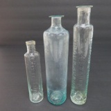 Three open pontil cylinder medicine bottles, 4