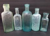 Five assorted old bottles including Fruit Salt with lid