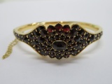 Garnet and 18K yellow gold bangle bracelet