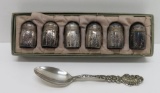 Six individual sterling salts and ornate sterling teaspoon, woman