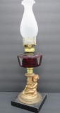 Cherub base oil lamp with ruby flash font, 19