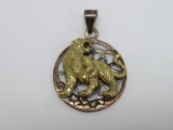 Brass and silver tiger pendant, unmarked, 1 1/2