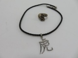 Chinese character necklace on leather cord and size 11 1/2 double headed tiger ring